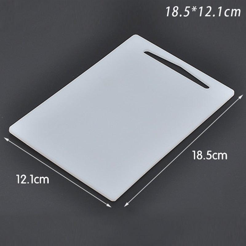 WHITE PLASTIC CUTTING BOARD